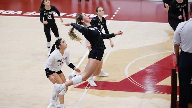 Emma Becker soars to hit one back in DII women's volleyball.