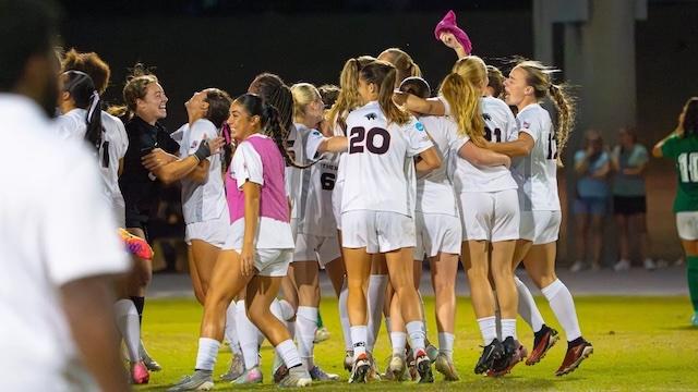 Florida Tech hugs at midfield after advancing to the DII women's soccer semifinals. 