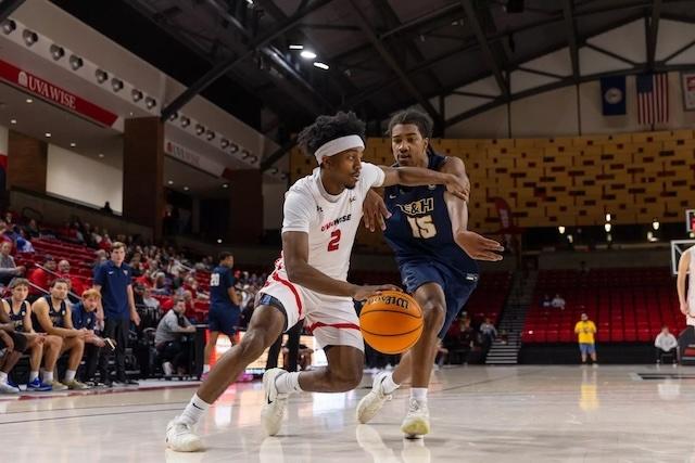 UVA Wise drives to the rim in DII men's basketball. 